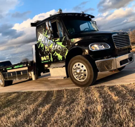 A black truck with text on its door